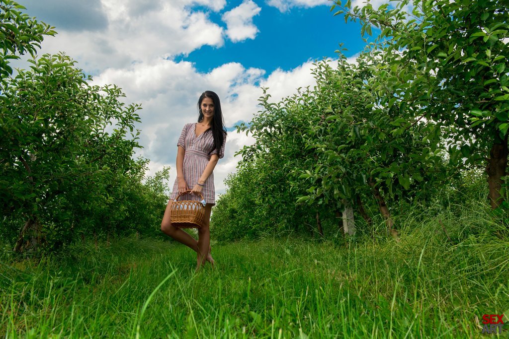 Katya enjoys an outdoor picnic in the orchard and a naughty outdoor masturbation.