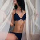 Katya prepares for a romantic me-time at the bathtub, strewn with pink rose petals, and an intimate moment with her favorite vibrator.