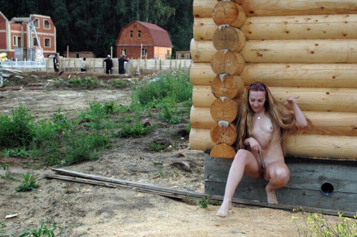 Naked blonde Asja with a vibrator hides from builders for the house