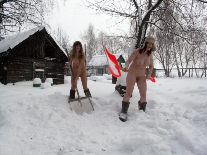 Two Russian girls clean roads at the cottage
