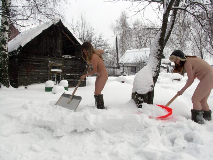 Two Russian girls clean roads at the cottage