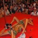 Two russian girls and vibrator in front of the crowd of viewers