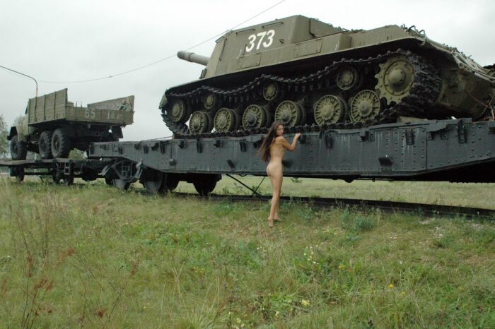 Very thin girl Margarita posing on a military train