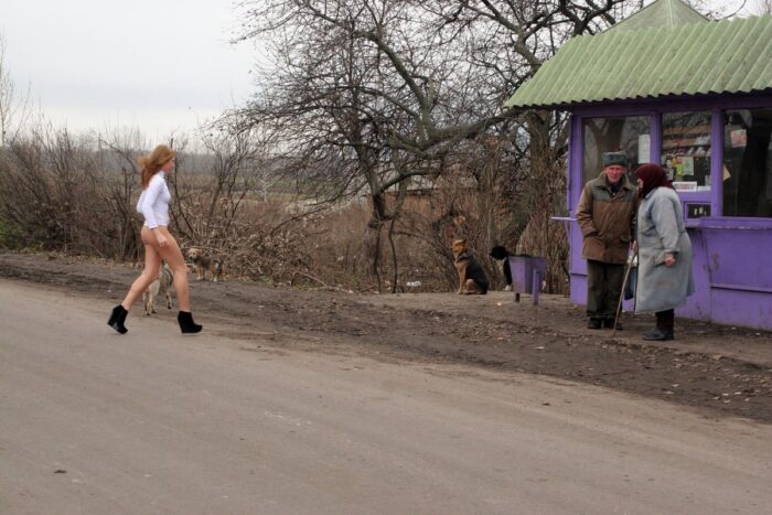 Bottomless blonde Ksenia Z walks to village residents