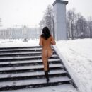 Busty brunette Daria Z in boots posing in a snowy park
