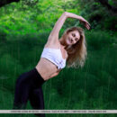 Christine Cardo shows off her flexibility as stretches her slim sexy body in the forest.
