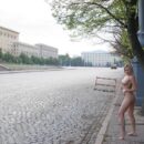Gorgeous blonde Olga G with beautiful boobs, walks naked at city center
