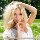 Lola A displays her grabable breasts and sexy long legs