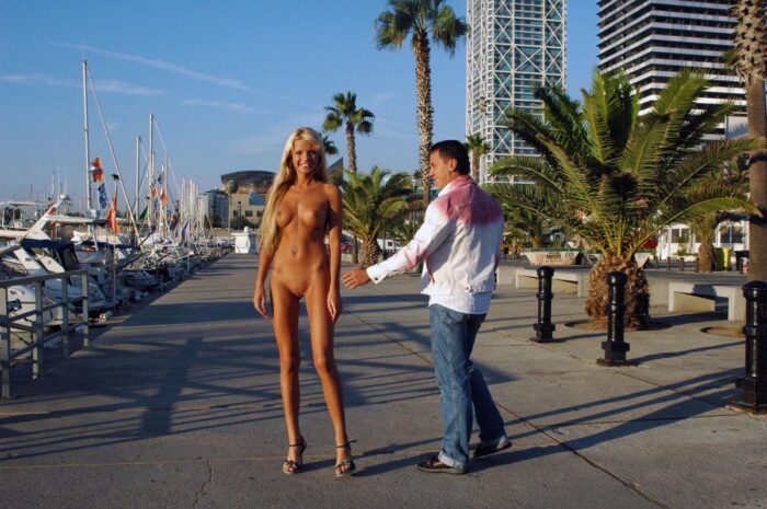Naked blonde Maria Leonova walks without clothes in the city port