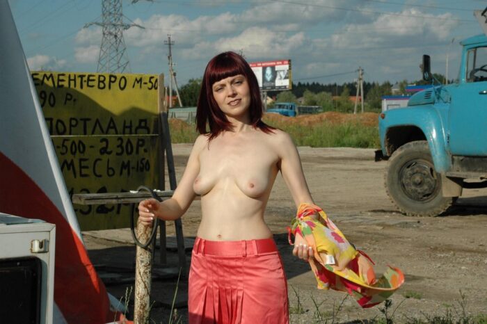 Russian redhead Oxana D undresses at construction site