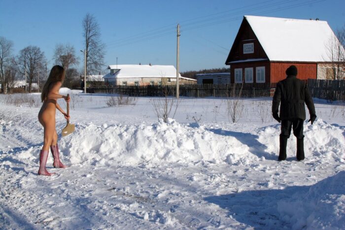 Sporty blonde Sveta S helps an old man clean snow