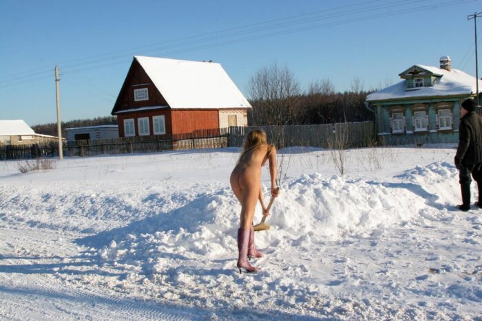 Sporty blonde Sveta S helps an old man clean snow