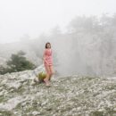 Sweet teen Vika A posing on a foggy hill