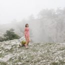 Sweet teen Vika A posing on a foggy hill