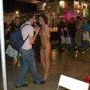 The girl without clothes Svetlana S is photographed with visitors at the exhibition