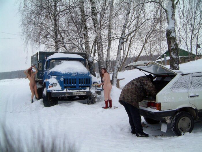 Two naked Russian girls clean the snow truck
