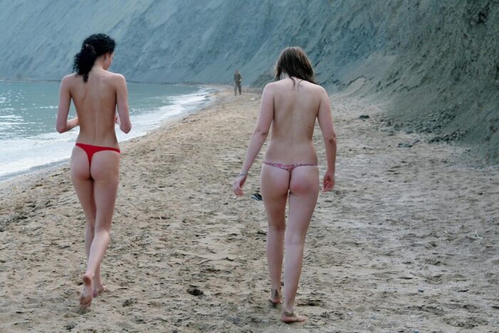 Two russian girls smoke naked at public beach