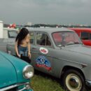 Young Russian girl removes panties next to the old car