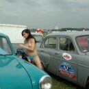 Young Russian girl removes panties next to the old car