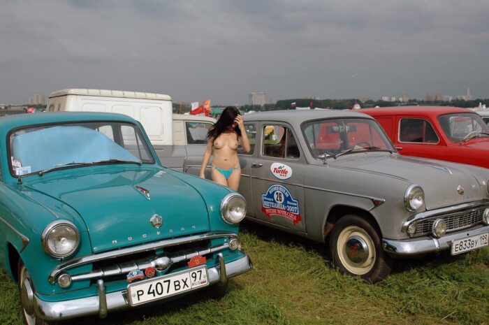 Young Russian girl removes panties next to the old car