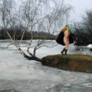 Young girl Kristina P in a scarf at the frozen lake