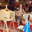 Russian girl with dreadlocks poses naked at erotic expo