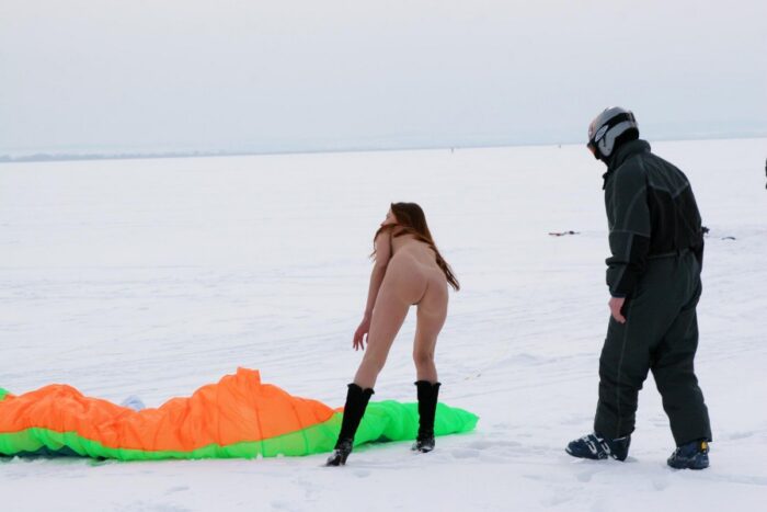 Young red-haired girl Tamara K with unshaven pussy on a frozen lake