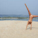 Beach beauty Afina shows off her flexibility