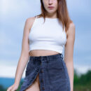Annamalia unbutton her denim high waist skirt then takes off her white crop top and flaunts her super hot hour glass bootylicious figure in the middle of an open field.