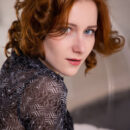 Gorgeous amber haired Rona Talin sexily removes her panties and exposes her flawless skin, small hard tits and trimmed muff on the indoor bubble swing.