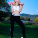 Monika Jelolt exercises on the green lush lawn and decides to divests her workout clothes and flashes her slim fit figure and pinkish smooth coochie on the yoga mat.