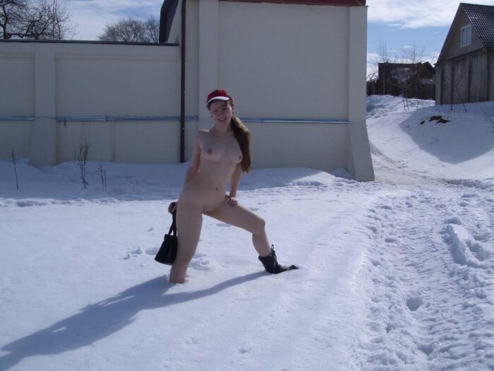 Russian girl Alena B with a handbag rolls bare in the snow