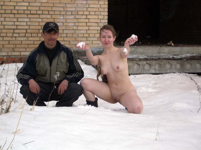 Blonde Alena B without clothes posing with a stranger on an abandoned building