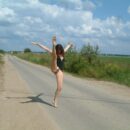 Fully naked girl Juna spreads her legs on the country road