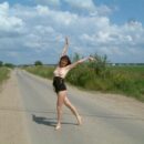 Fully naked girl Juna spreads her legs on the country road