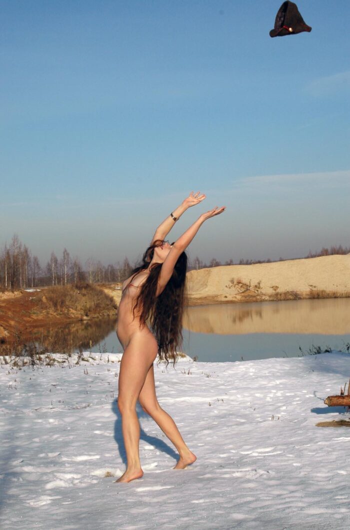 Long-haired russian teen Angelika posing outdoors at winter