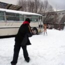 Naked Lena W plays snowball with dressed strangers