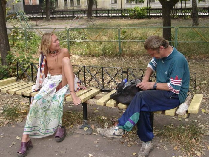 Russian blonde Elena posing on a bench with drunkard