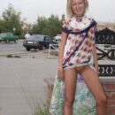 Russian blonde Elena posing on a bench with drunkard