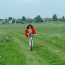 Russian girl Juna with hairy pussy on bycicle outdoors