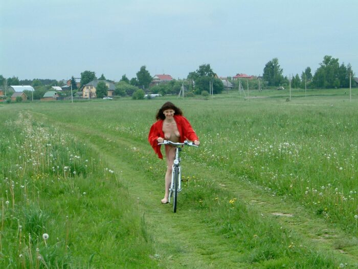 Russian girl Juna with hairy pussy on bycicle outdoors