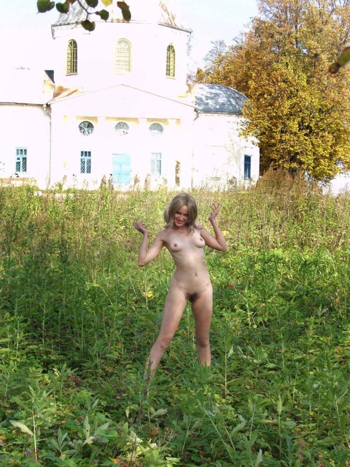 Smiling blonde Natalia K with hairy pussy in public country places