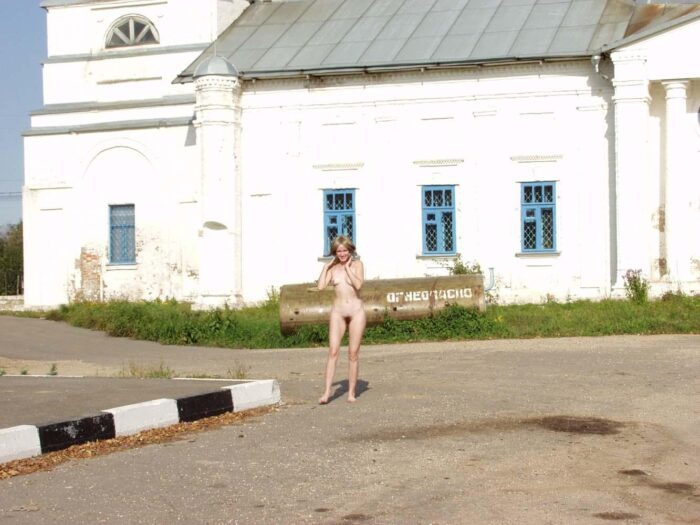 Smiling blonde Natalia K with hairy pussy in public country places