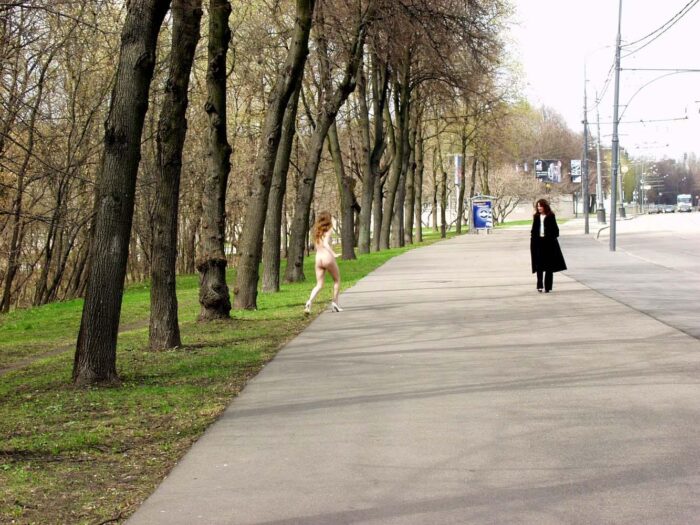Two russian lesbians kiss in the public park