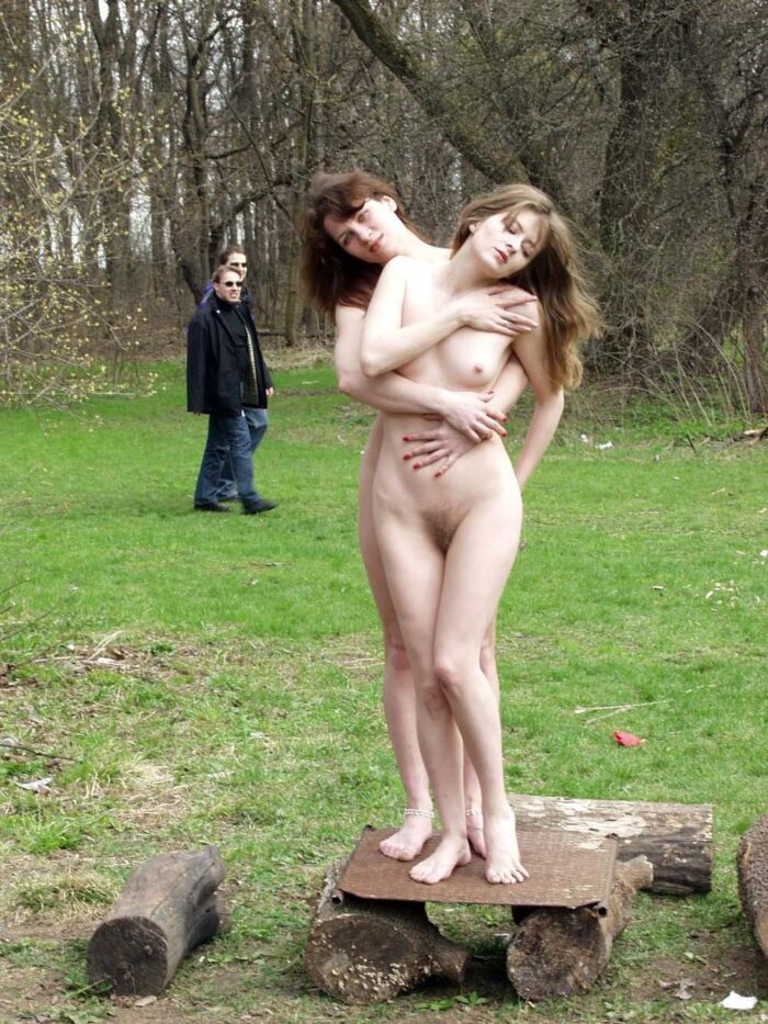 Two russian lesbians kiss in the public park