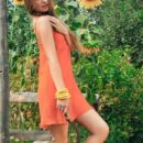 Bridgit A’s natural beauty and youthful body stands out amongst the lovely sunflowers