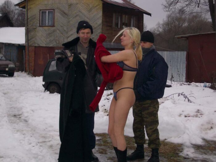 Depraved blonde Natalia S is photographed with local citizens at winter