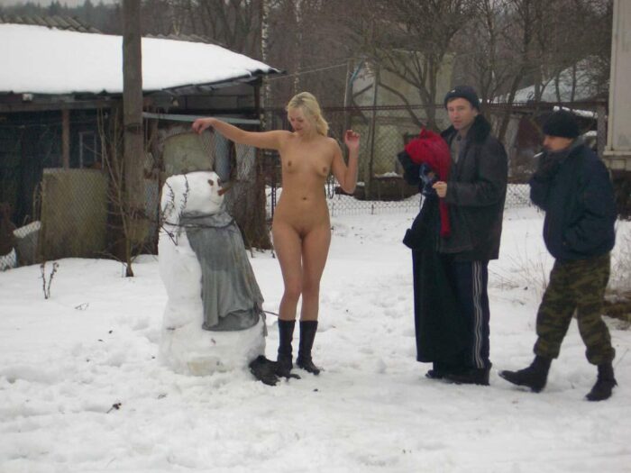 Depraved blonde Natalia S is photographed with local citizens at winter