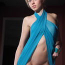 Katy D takes off her blue coverup and shows off her assets