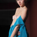 Katy D takes off her blue coverup and shows off her assets